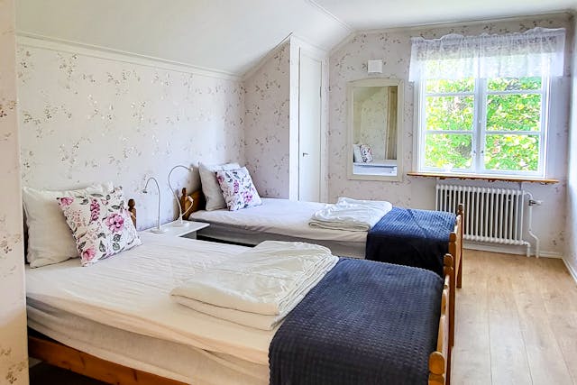 La chambre du cycliste à River Lodge dispose de deux lits simples. La chambre est confortable et se trouve à côté du salon et de la cuisine.